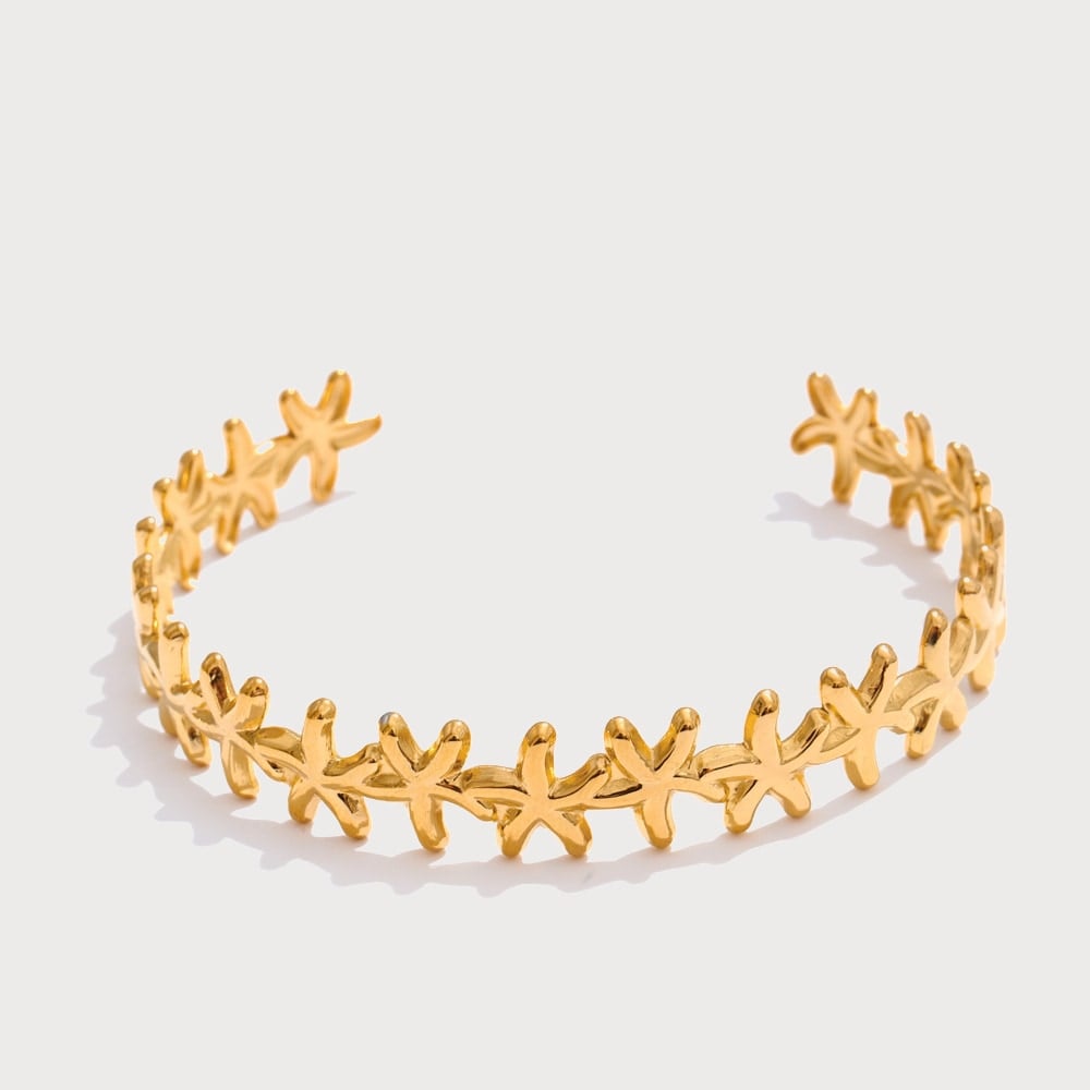 Bracelet jonc ouvert à motifs marins en acier inoxydable doré | Bloom × Blaze