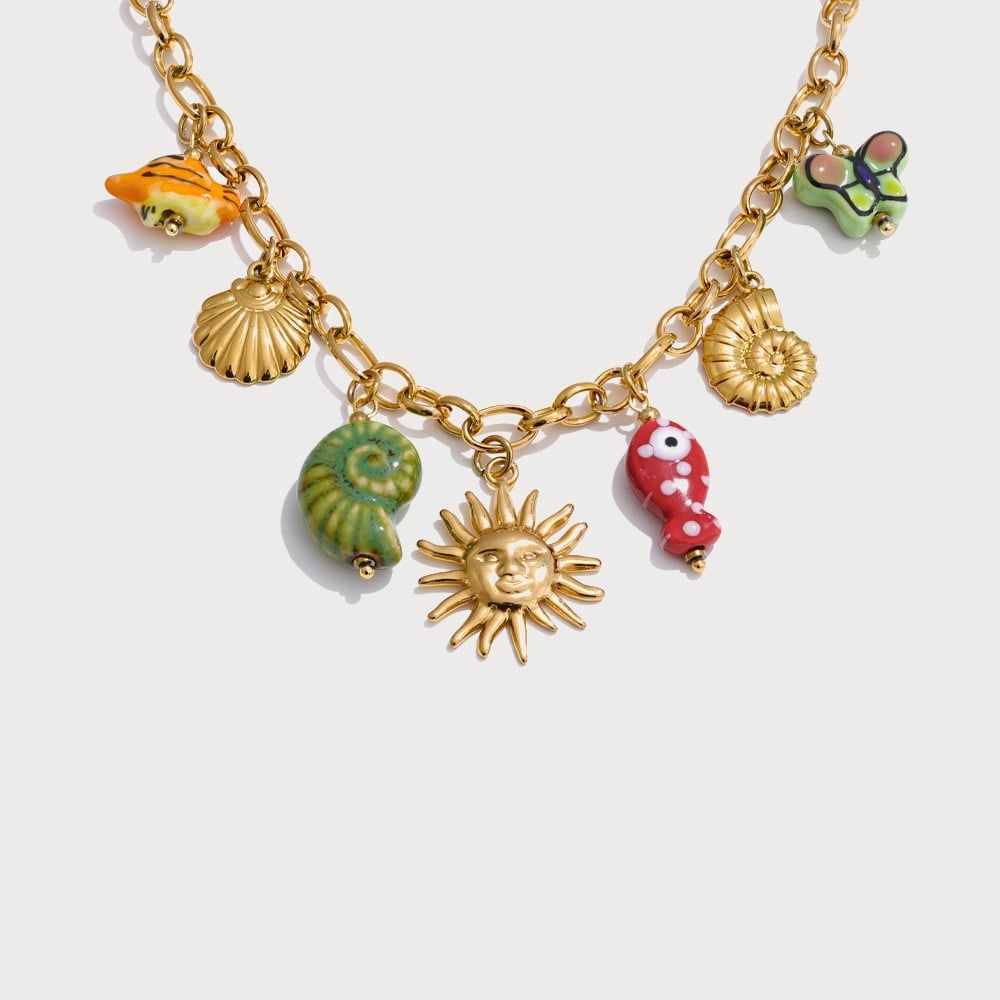 Collier de perles et breloques coquillages, poissons et soleils en céramique | Bloom × Blaze